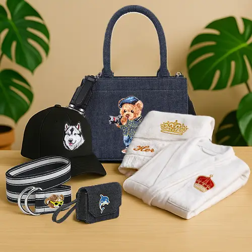 A display of embroidered lifestyle products from Kolorobia including a denim handbag, cap, bathrobes, belt, and pouch and more —highlighting the brand’s diverse range of stylish and personalized embroidered merchandise