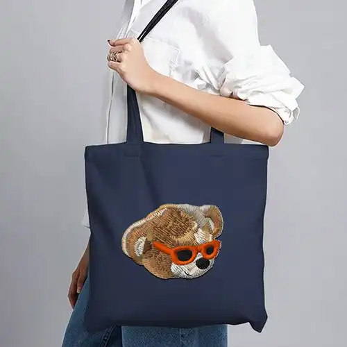 Embroidered Blue Jhola Bag With Retro Bear Design