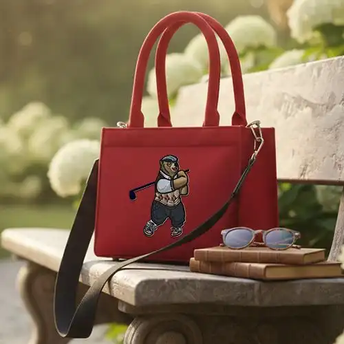 embroidered small bag with glofing grizzely bear design