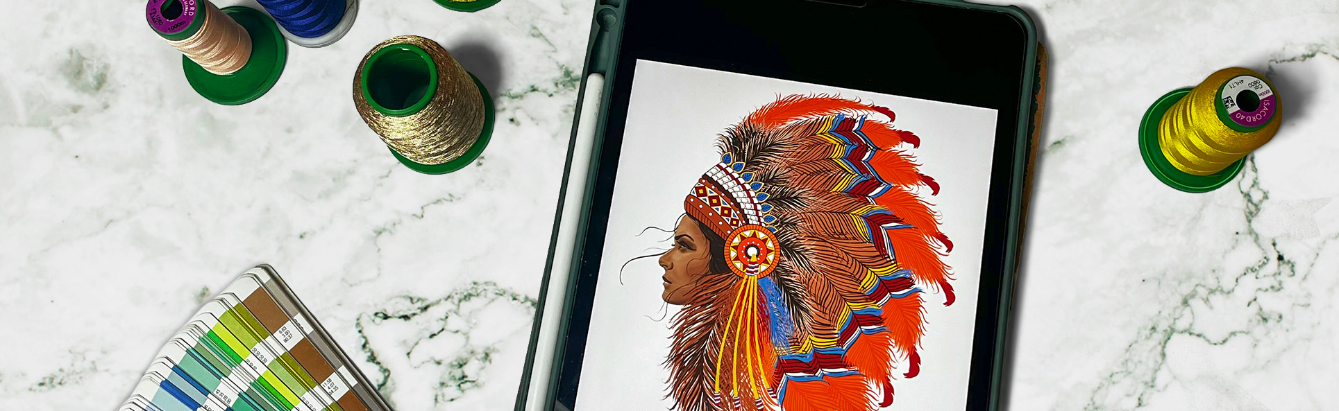 Final digital embroidery design of a woman in a feathered headdress displayed on a tablet, surrounded by colorful embroidery threads and color swatches