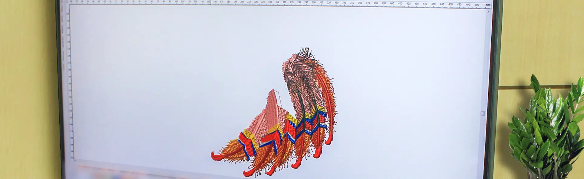 Screen displaying advanced digitizing of an intricate feather embroidery design, showcasing the embroidery file preparation process