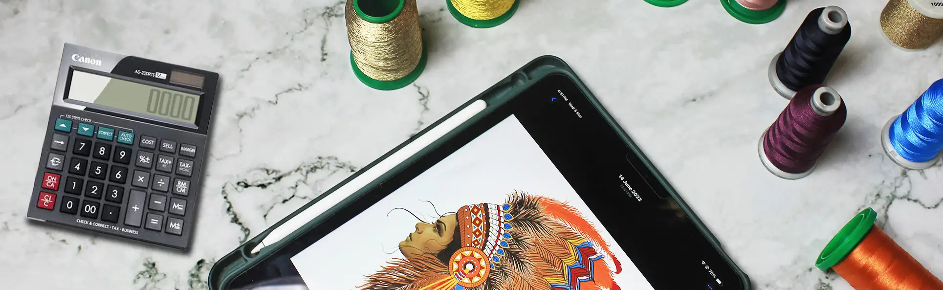 Flat lay of embroidery threads, a design on a tablet, and a calculator showcasing embroidery design costing and planning process
